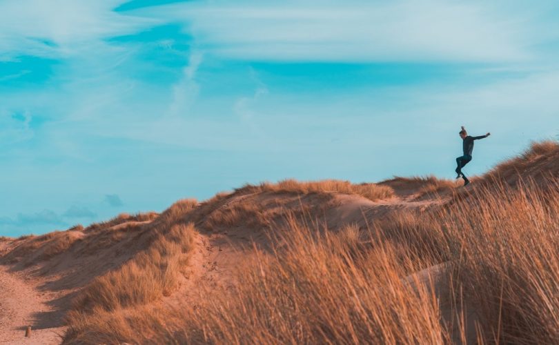 person on brown terrain